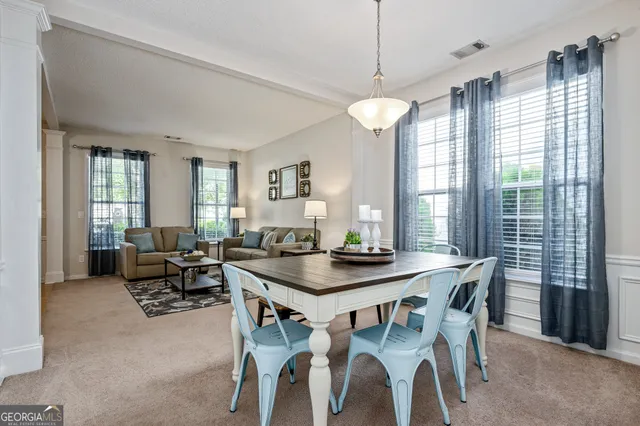 a view of a dining room with furniture window and outside view