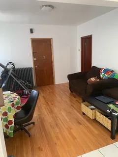 a bedroom with a bed and dresser