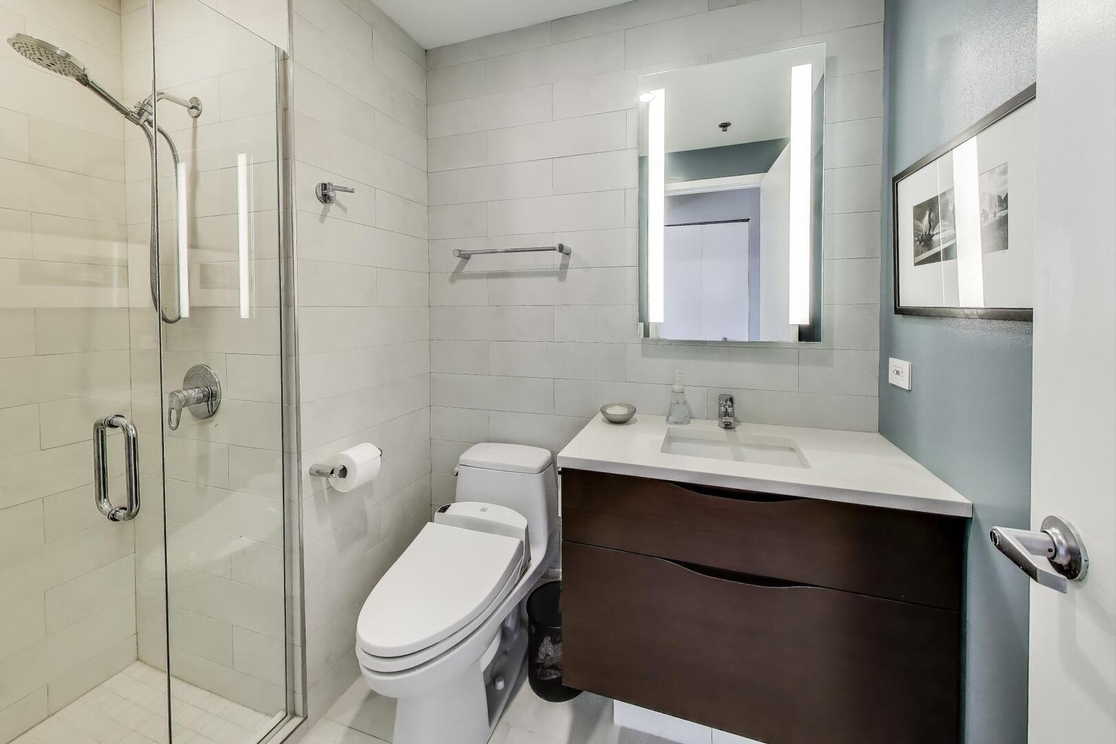 1530 South State Street, Unit 12J Chicago, IL 60605 - Photo 13 of 28 a bathroom with a sink toilet and shower