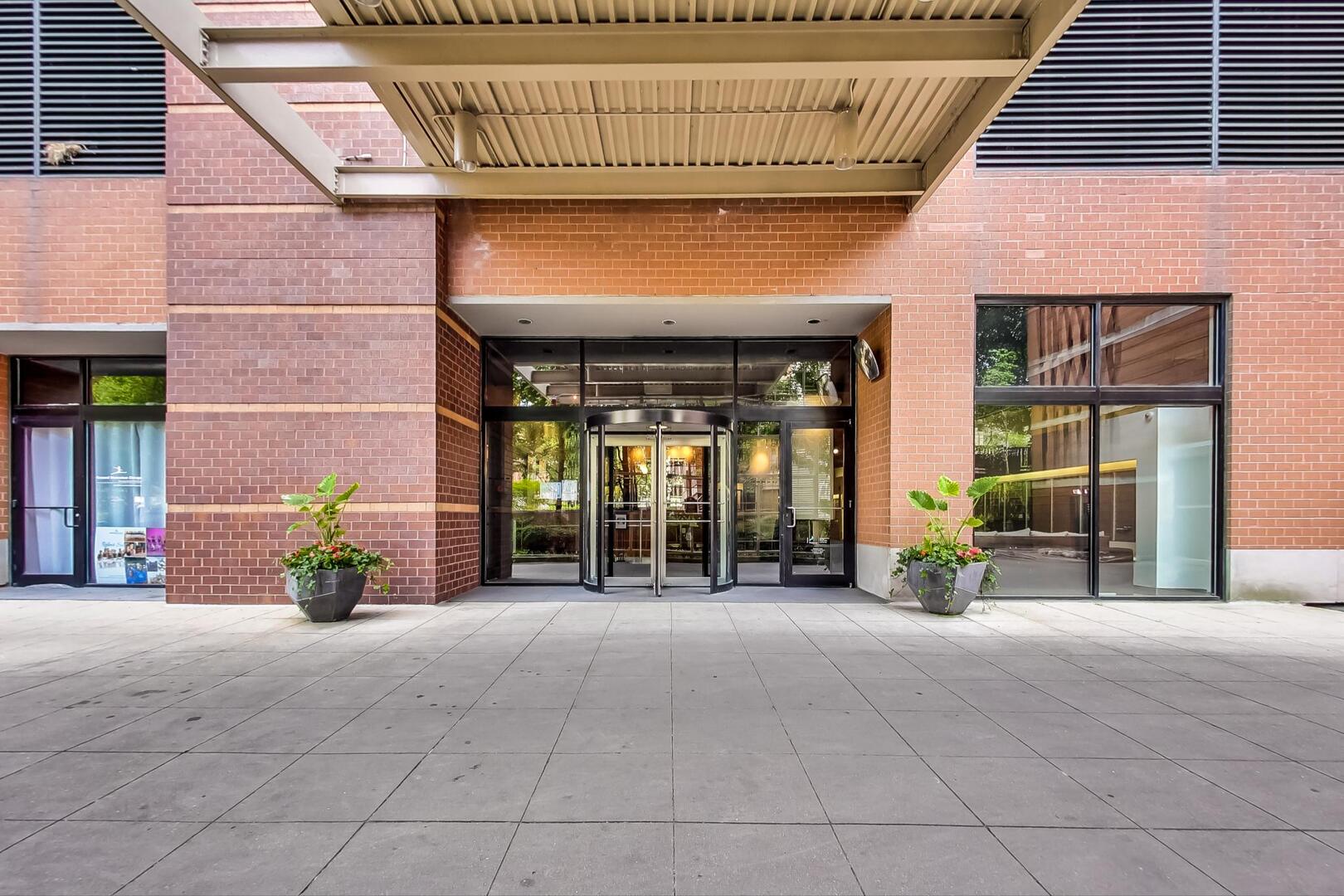 1530 South State Street, Unit 12J Chicago, IL 60605 - Photo 2 of 28 a view of a brick house with large windows