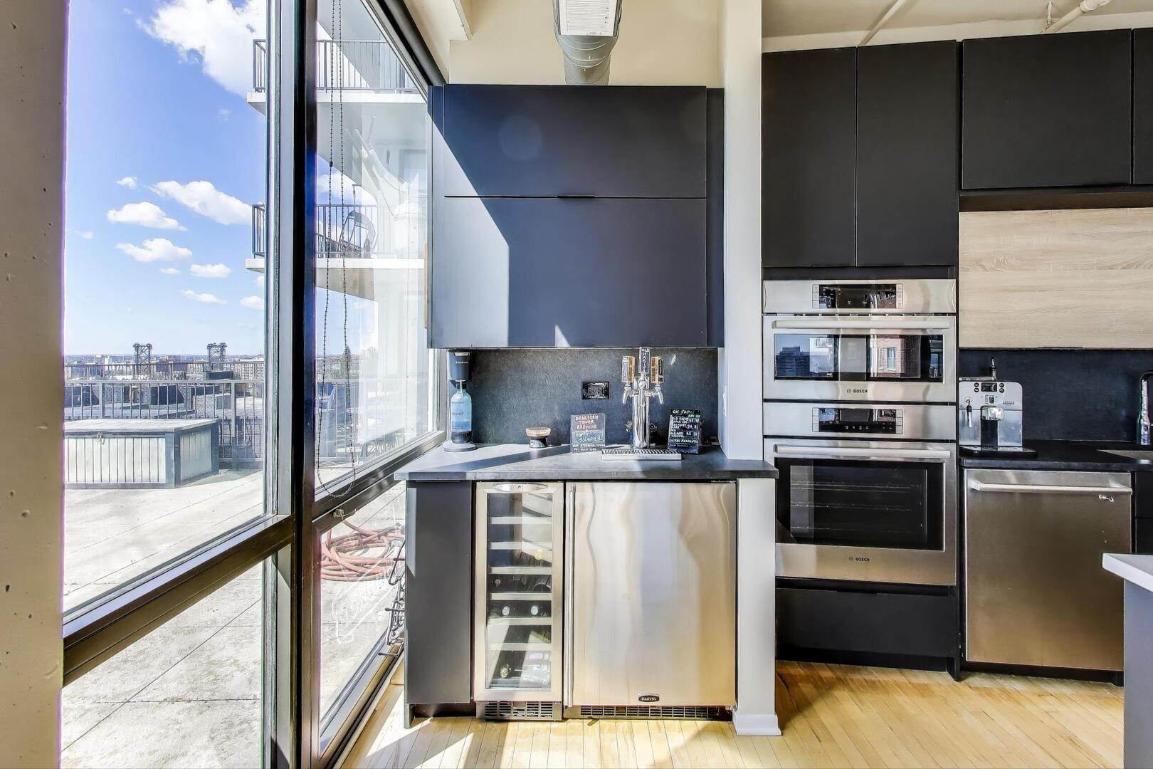 1530 South State Street, Unit 12J Chicago, IL 60605 - Photo 8 of 28 a kitchen with stainless steel appliances a stove and a refrigerator
