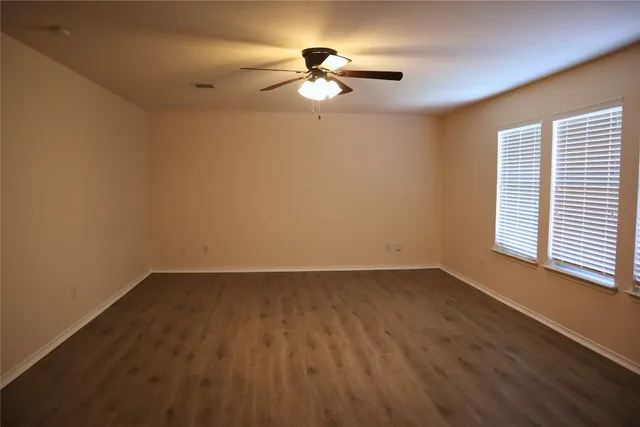 a bathroom with a double vanity sink toilet and a bathtub