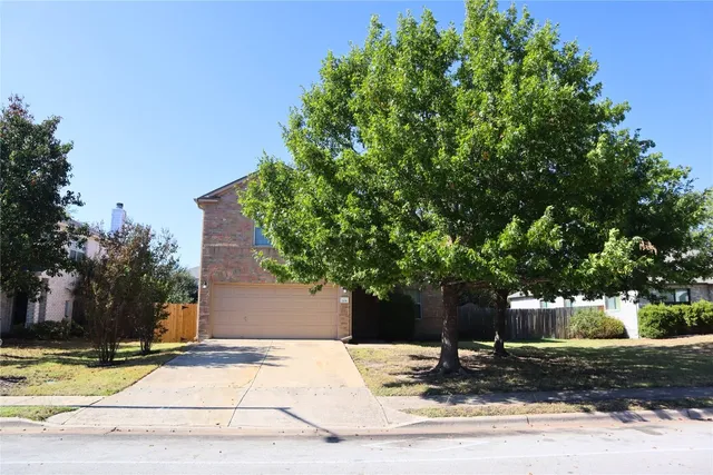 a wooden bench sitting in front of a house