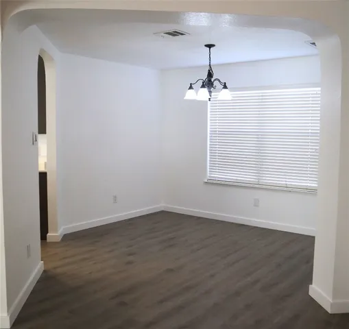 a kitchen with kitchen island a sink stainless steel appliances and cabinets