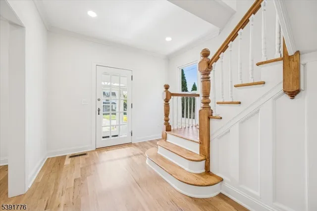 a view of entryway with wooden floor