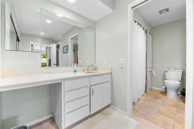 a bathroom with a toilet and a bathtub