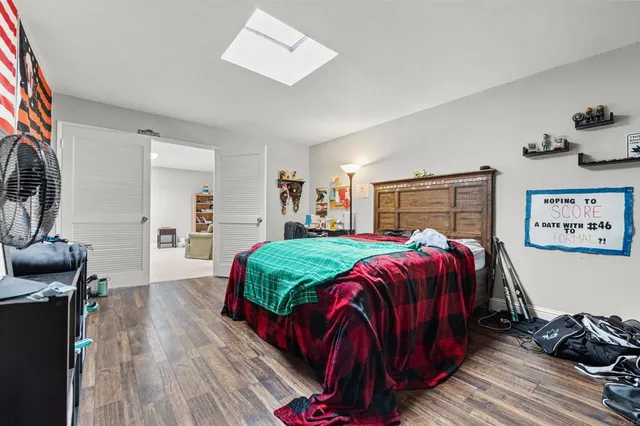 a bed room with a bed and a walk in closet