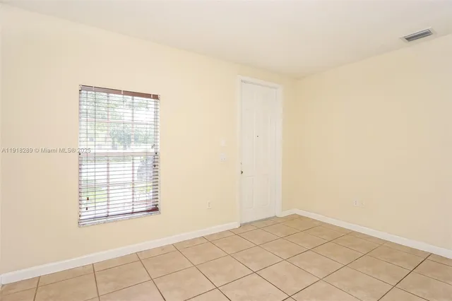 a view of an empty room and window