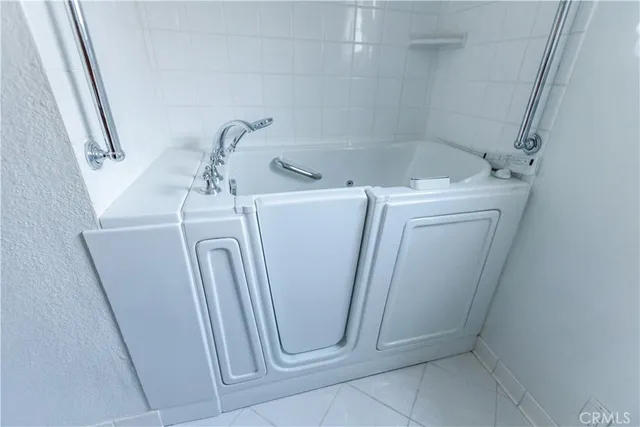 a bathroom with a sink and washing machine