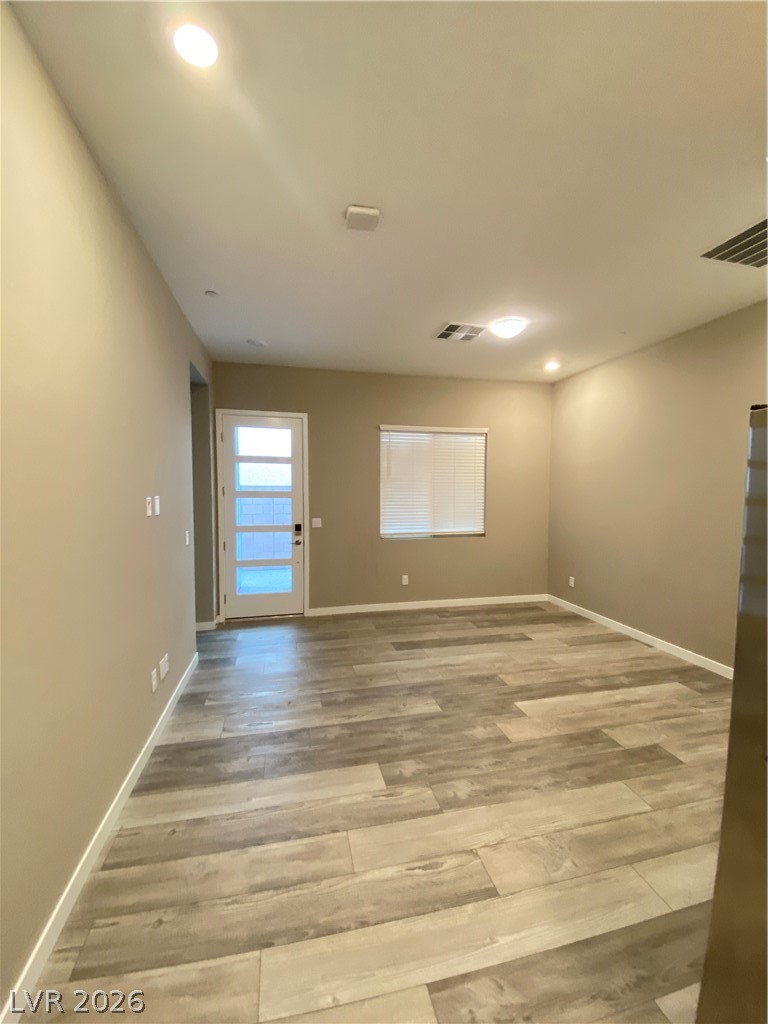 695 Daylight Ridge Court Henderson, NV 89052 - Photo 13 of 27 Empty room featuring light wood-type flooring and recessed lighting