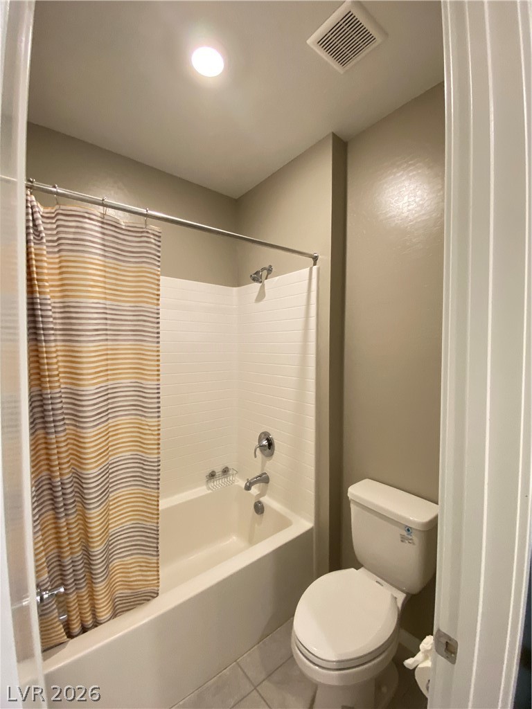695 Daylight Ridge Court Henderson, NV 89052 - Photo 24 of 27 Bathroom with shower / tub combo with curtain and tile patterned flooring
