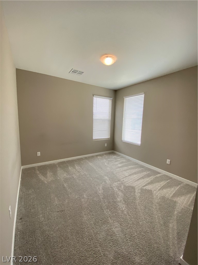 695 Daylight Ridge Court Henderson, NV 89052 - Photo 25 of 27 Carpeted spare room featuring baseboards
