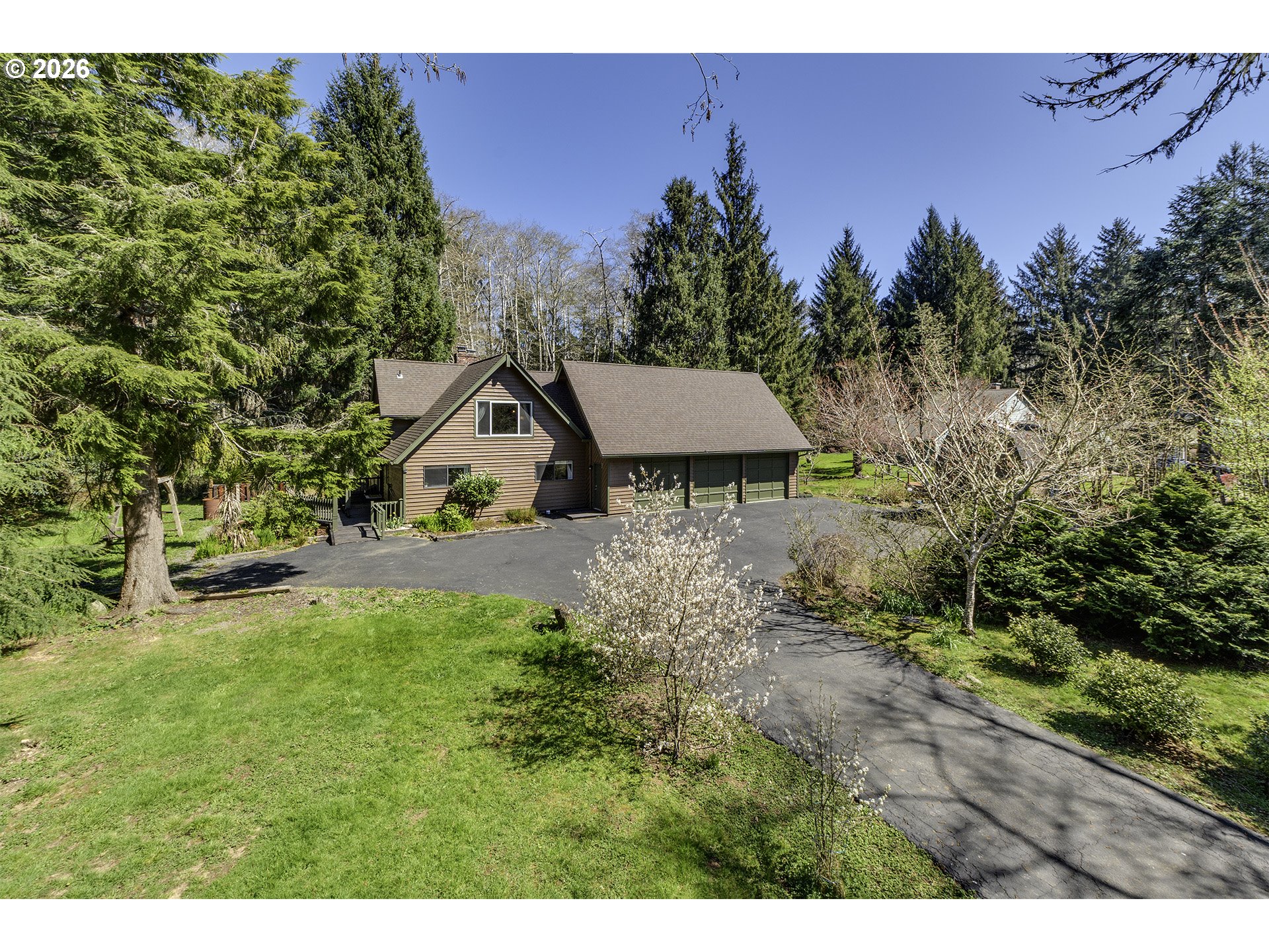 34049 West Campbell Loop Seaside, OR 97138 - Photo 1 of 48 a house view with a garden space