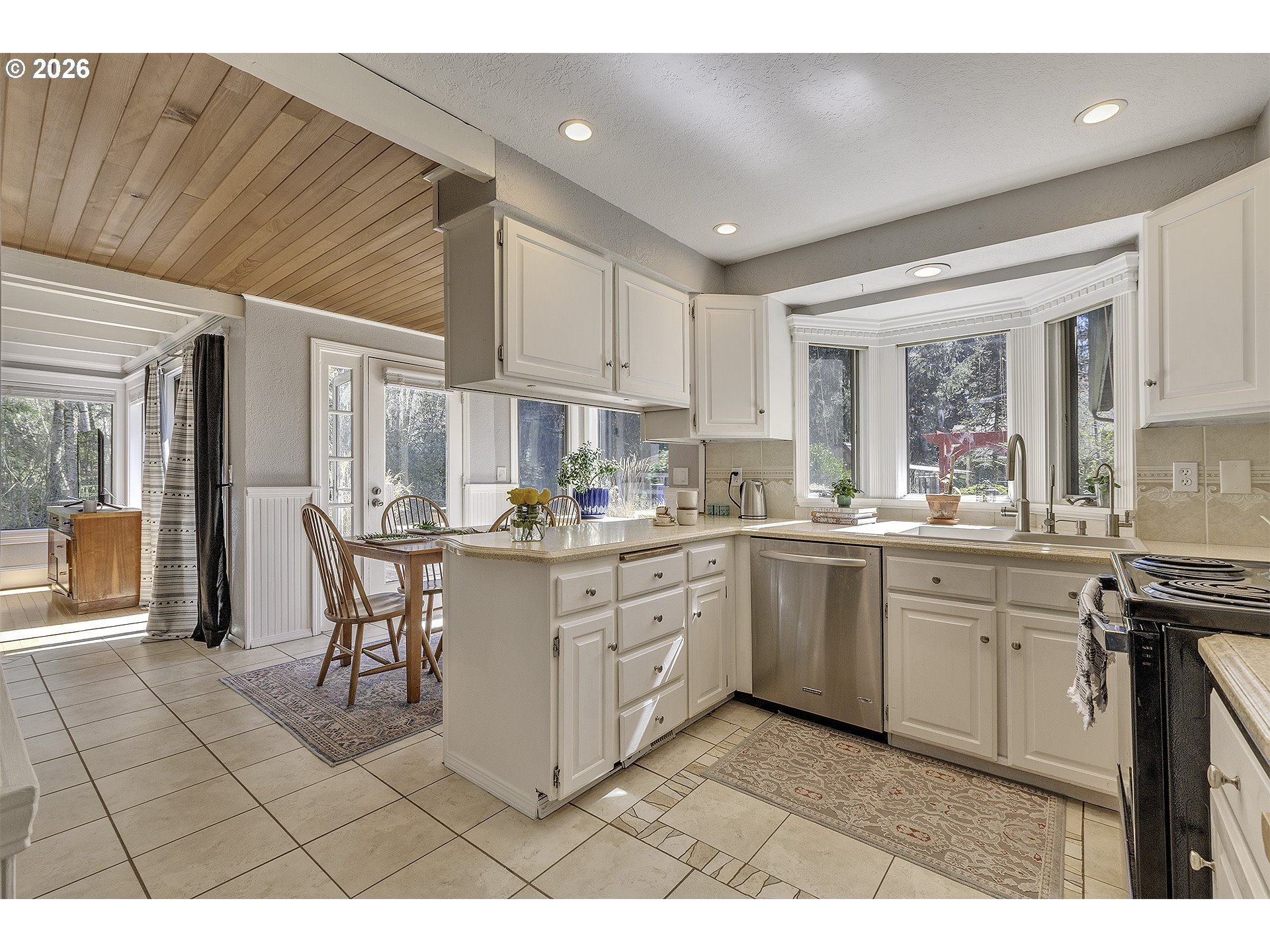 34049 West Campbell Loop Seaside, OR 97138 - Photo 13 of 48 a kitchen with cabinets and outdoor view