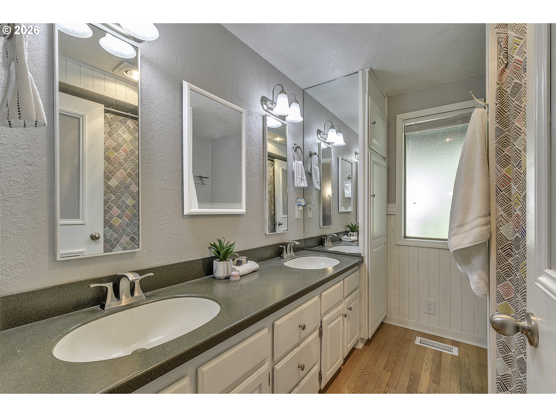 34049 West Campbell Loop Seaside, OR 97138 - Photo 19 of 48 a bathroom with a sink double vanity granite and a mirror