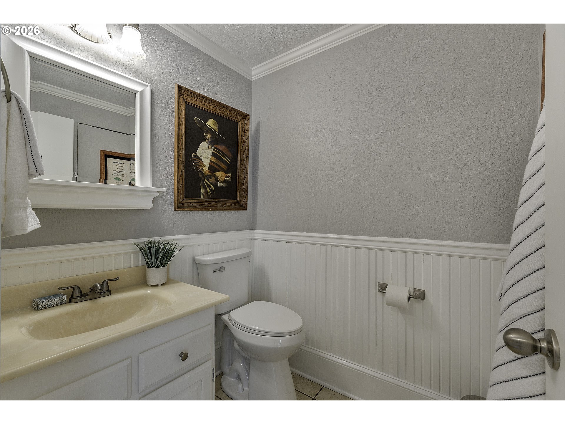 34049 West Campbell Loop Seaside, OR 97138 - Photo 22 of 48 a bathroom with a toilet a sink and mirror