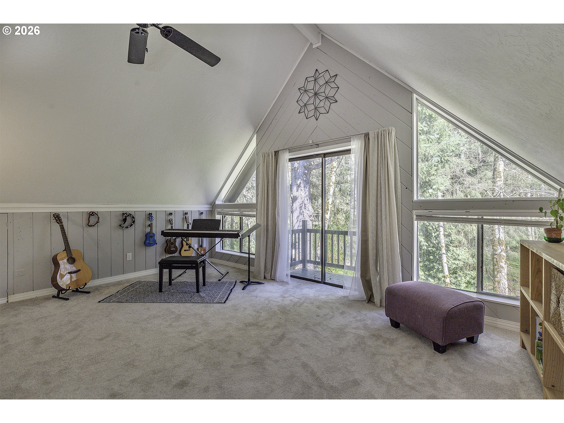 34049 West Campbell Loop Seaside, OR 97138 - Photo 25 of 48 a living room with furniture and a floor to ceiling window