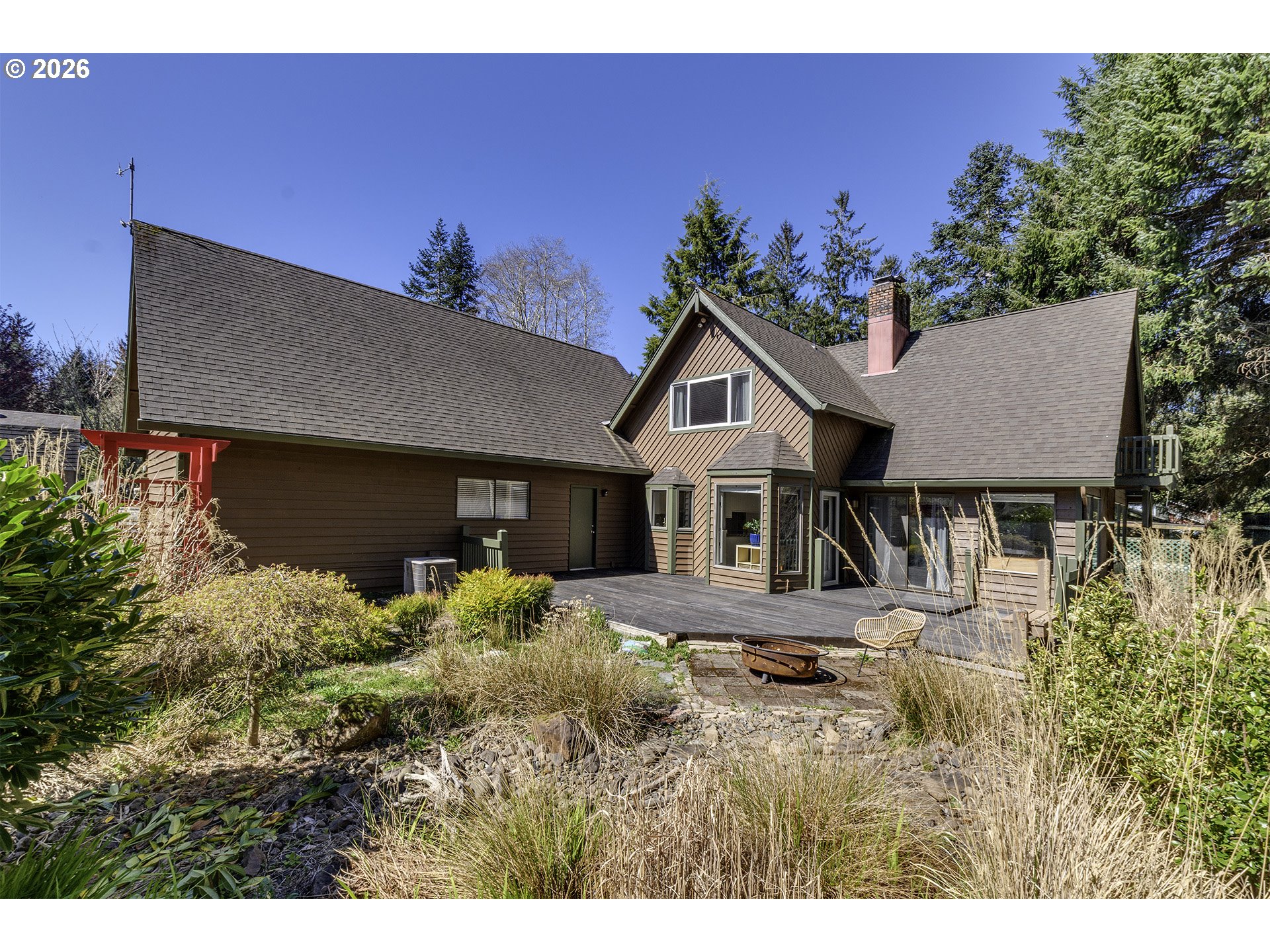 34049 West Campbell Loop Seaside, OR 97138 - Photo 35 of 48 a front view of a house with a yard
