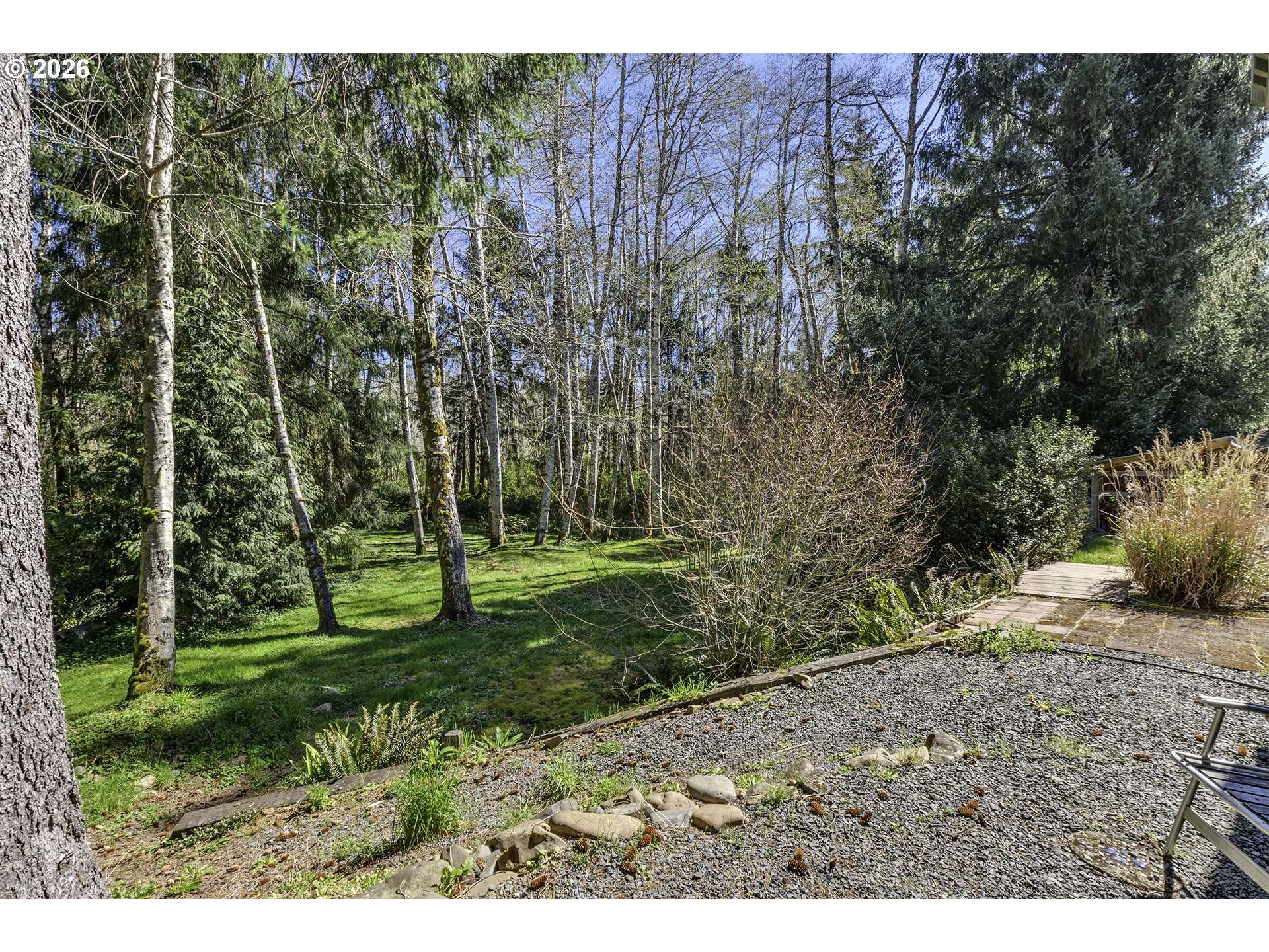 34049 West Campbell Loop Seaside, OR 97138 - Photo 42 of 48 a view of a backyard with trees