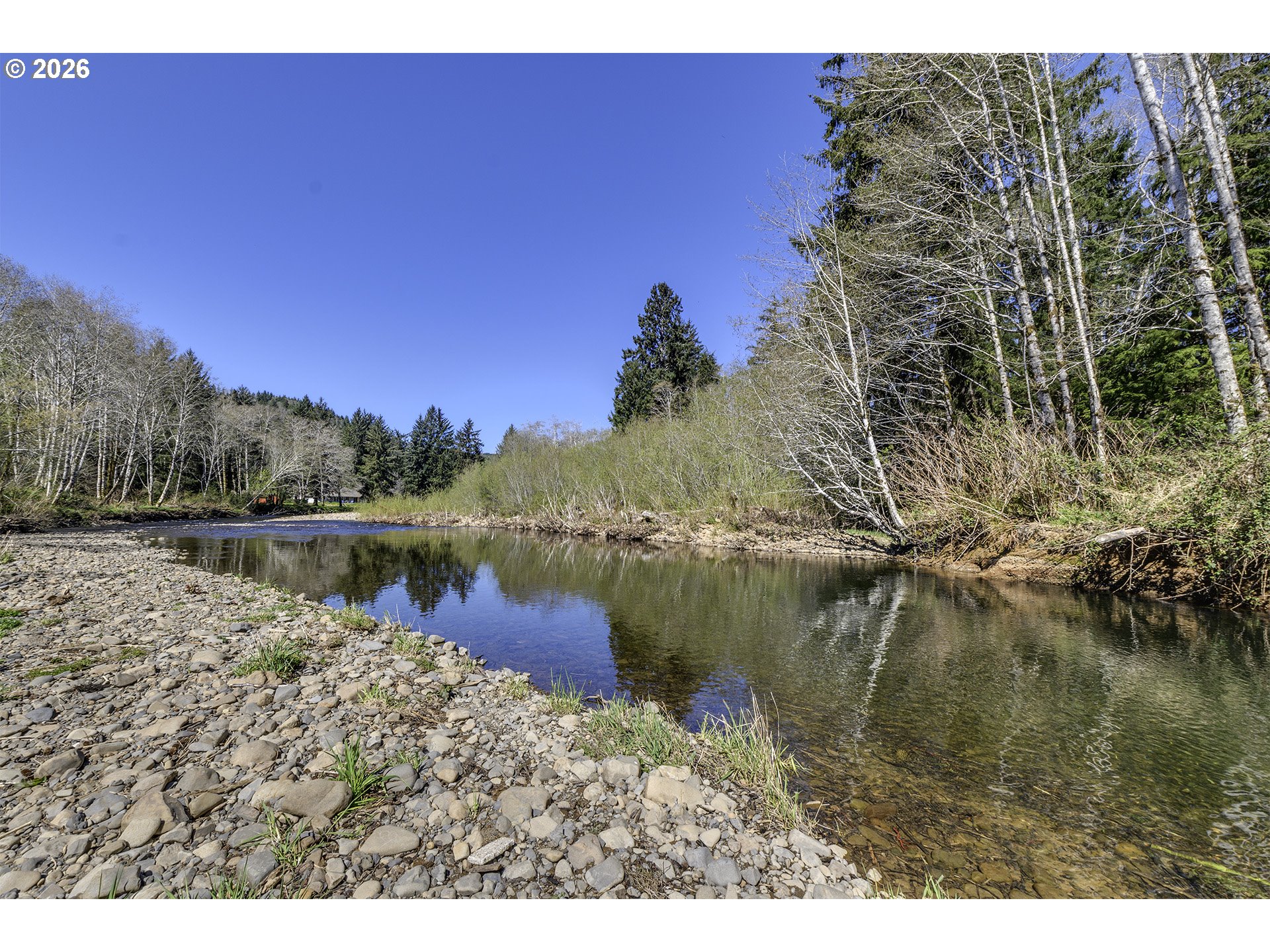 34049 West Campbell Loop Seaside, OR 97138 - Photo 46 of 48 a view of a lake with a mountain in the background