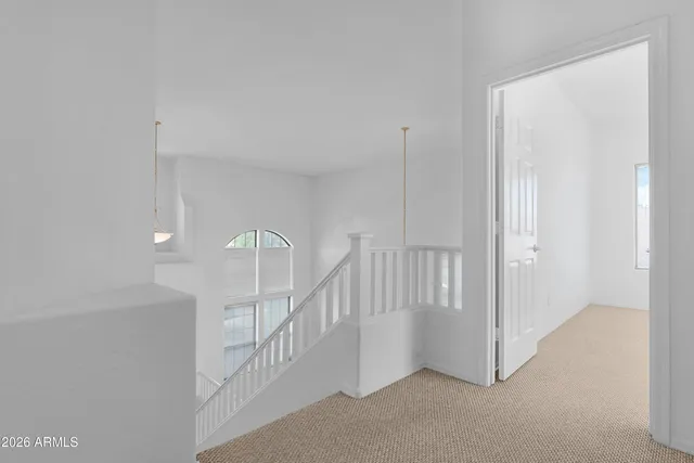 a view of a kitchen with furniture and wooden floor
