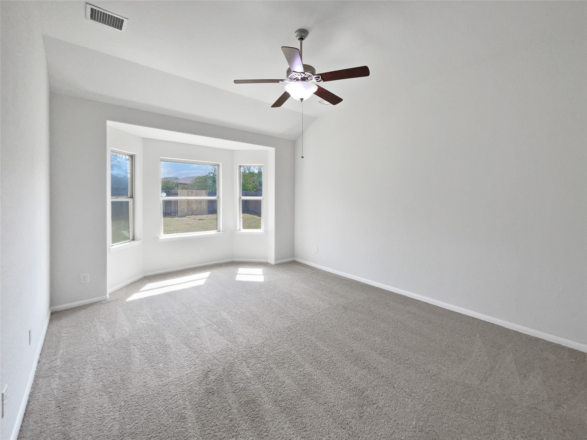 7323 Collins Manor Drive Spring, TX 77389 - Photo 13 of 22 a view of a livingroom with a ceiling fan and window