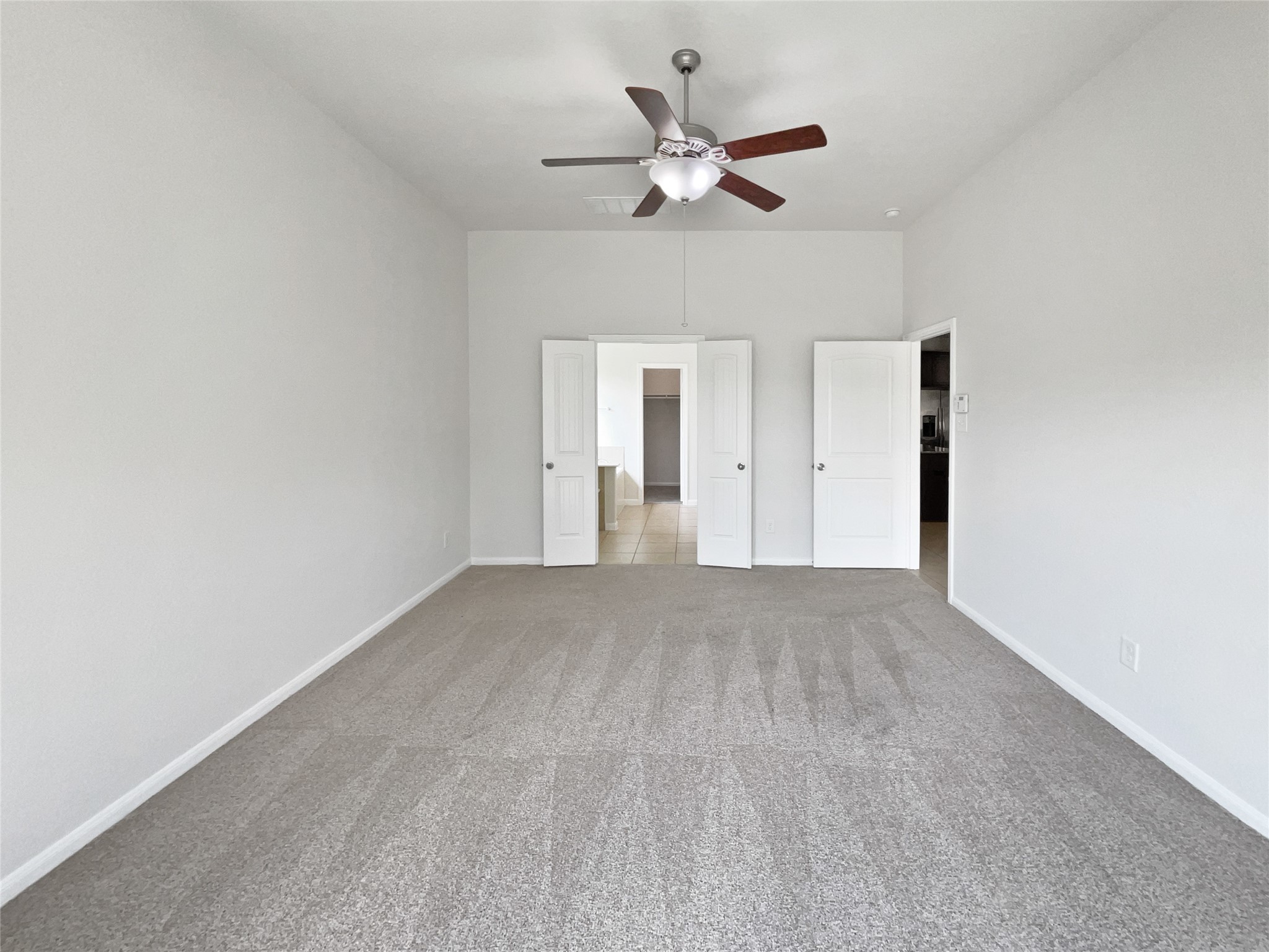 7323 Collins Manor Drive Spring, TX 77389 - Photo 14 of 22 an empty room with a ceiling fan and a window