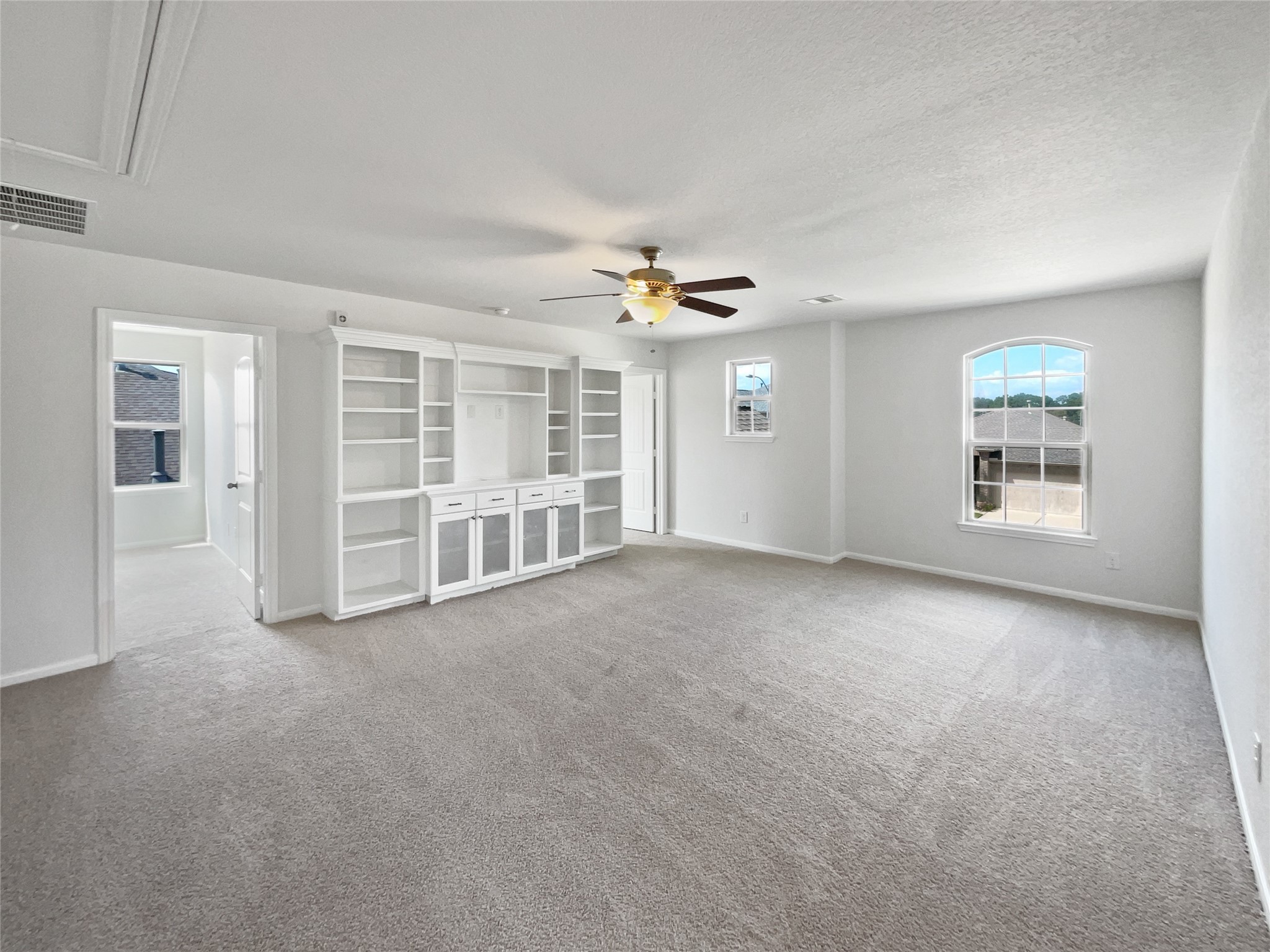 7323 Collins Manor Drive Spring, TX 77389 - Photo 16 of 22 a view of a livingroom with a ceiling fan and window