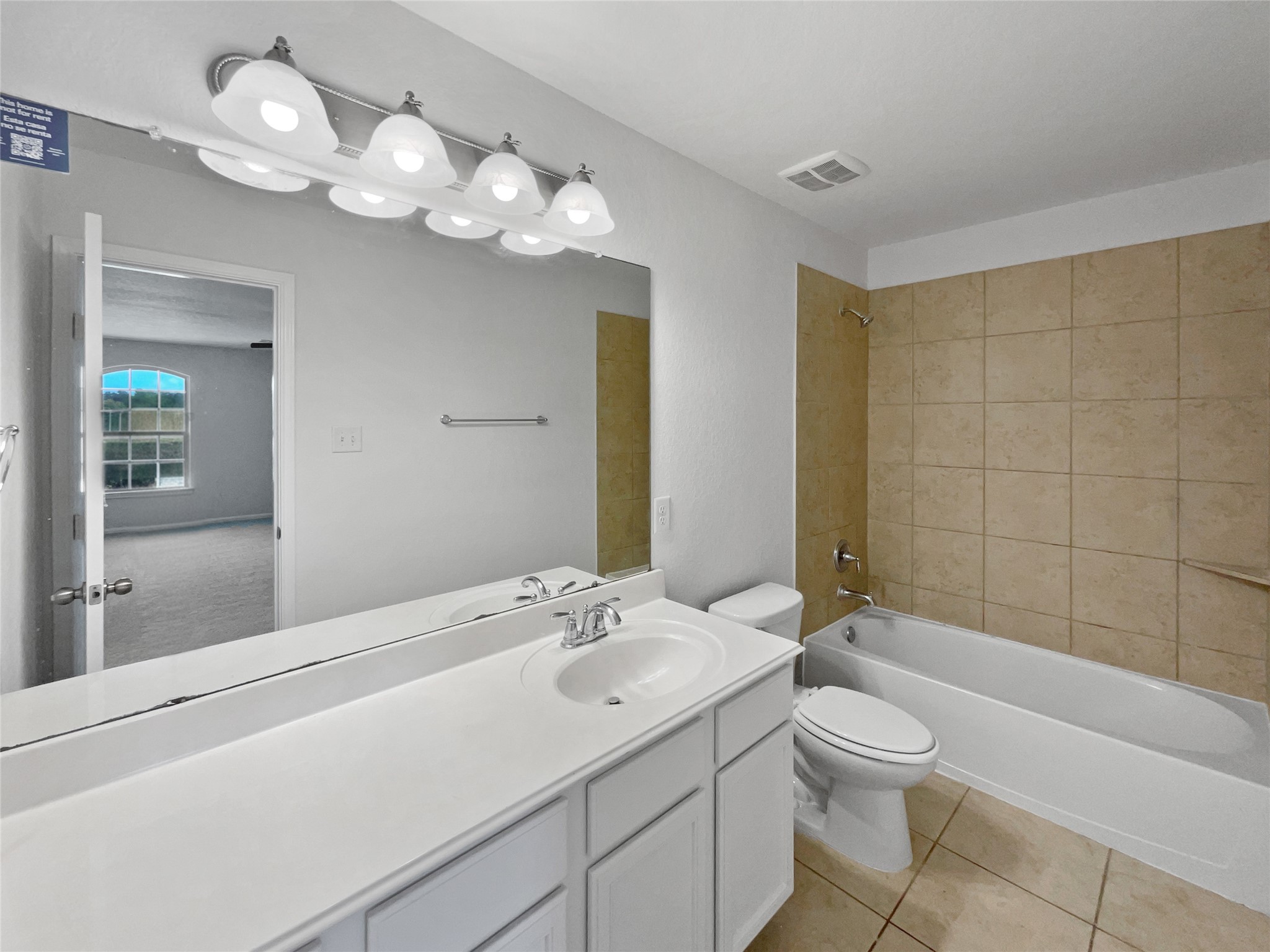 7323 Collins Manor Drive Spring, TX 77389 - Photo 19 of 22 a bathroom with a sink a toilet and a mirror