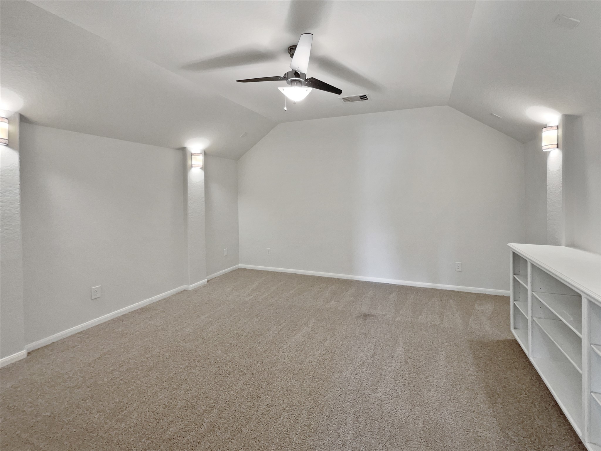 7323 Collins Manor Drive Spring, TX 77389 - Photo 20 of 22 an empty room with chandelier fan and windows
