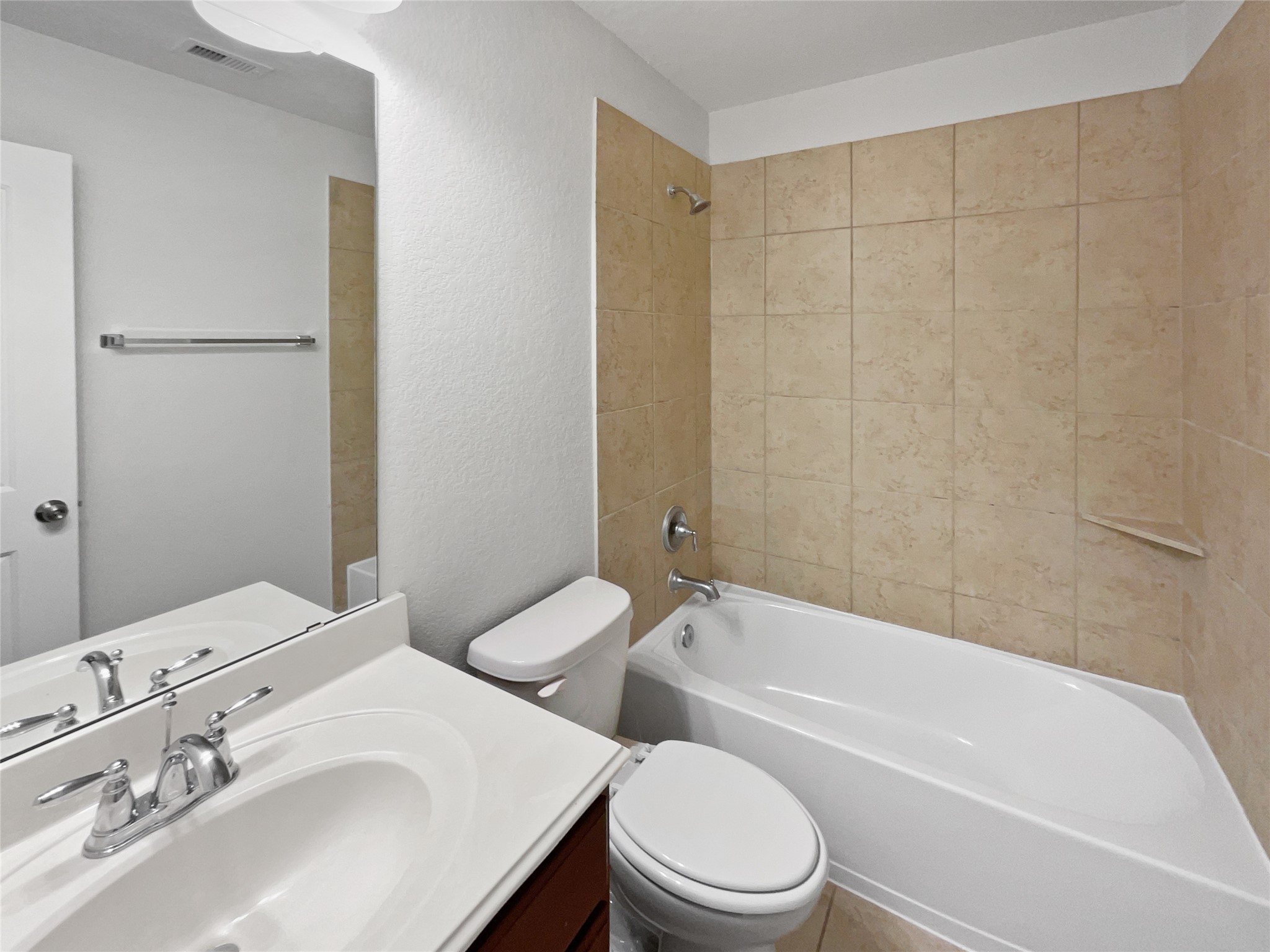 7323 Collins Manor Drive Spring, TX 77389 - Photo 21 of 22 a bathroom with a toilet a sink and bathtub