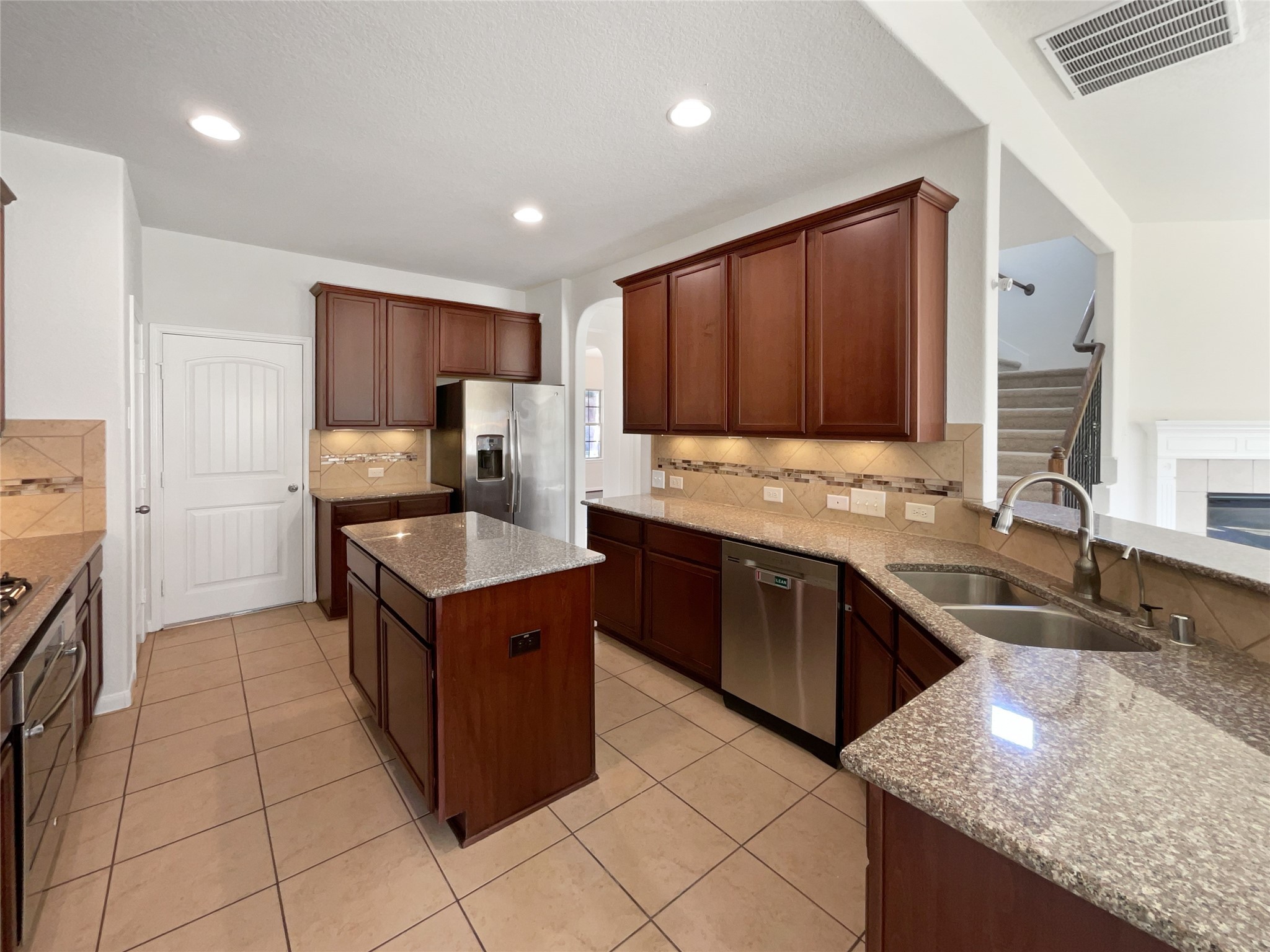 7323 Collins Manor Drive Spring, TX 77389 - Photo 6 of 22 a kitchen with stainless steel appliances granite countertop a sink counter space and cabinets