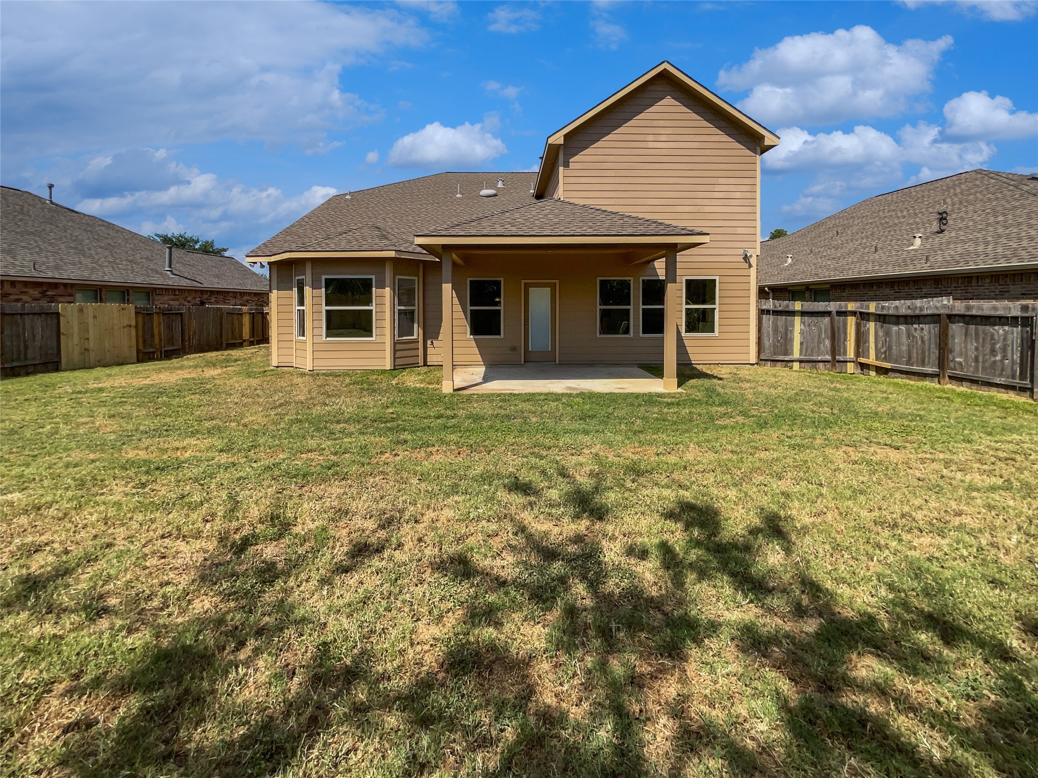 7323 Collins Manor Drive Spring, TX 77389 - Photo 8 of 22 a front view of a house with a garden