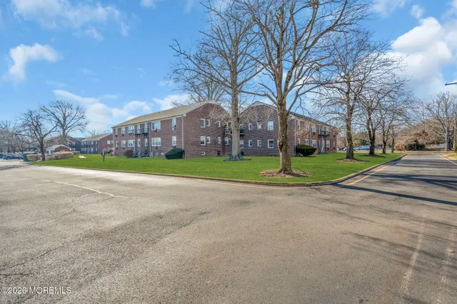 a view of a road with a building in the background