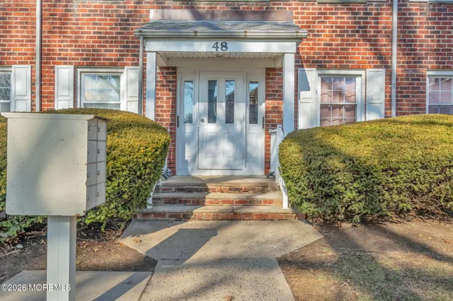 a view of a building with potted plants