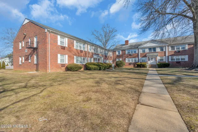 a front view of building with yard