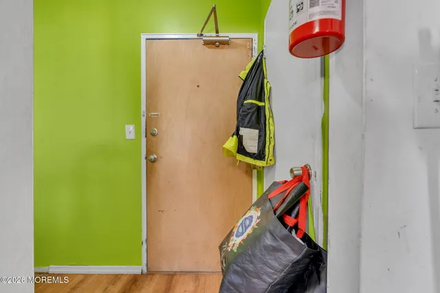 a view of a bedroom with a bed and toys