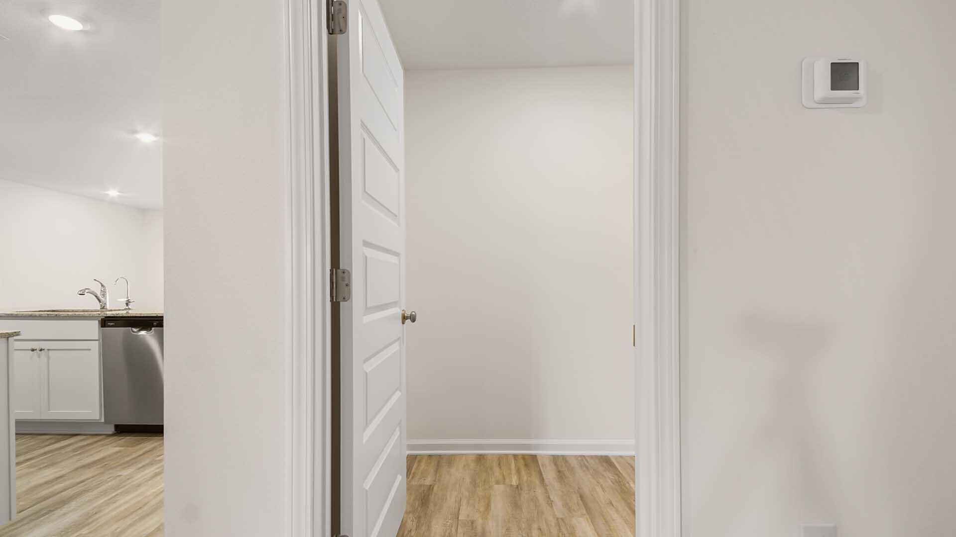 135 Dockside Road Freeport, FL 32439 - Photo 21 of 31 a view of a hallway with closet and wooden floor