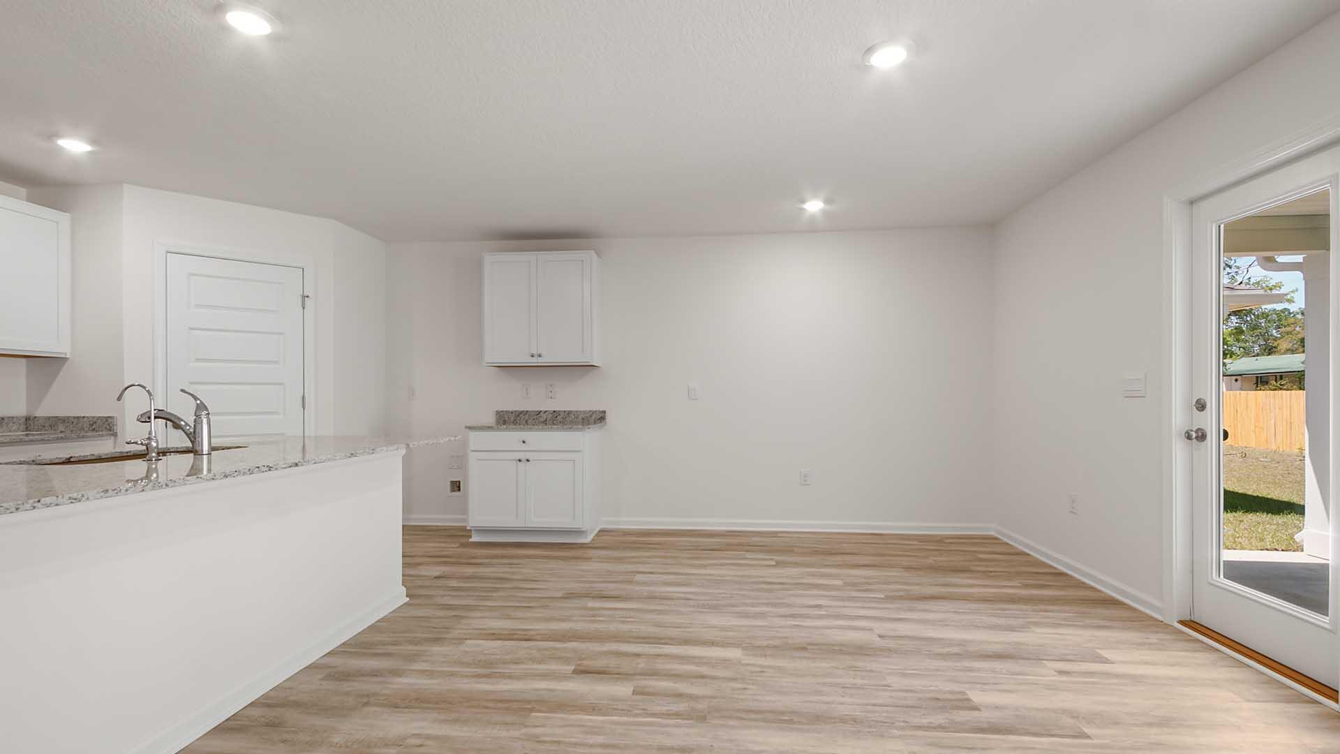 135 Dockside Road Freeport, FL 32439 - Photo 9 of 31 a room with a sink cabinets and wooden floor