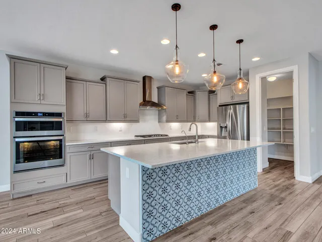 a kitchen with a sink and a refrigerator