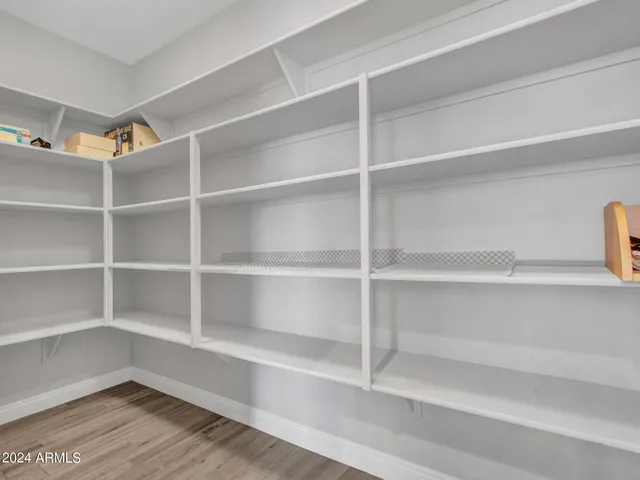 a view of a room with wooden floor and staircase
