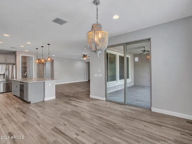 a spacious bathroom with a large tub shower and sink