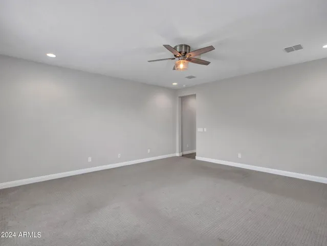 a bathroom with a sink mirror and toilet