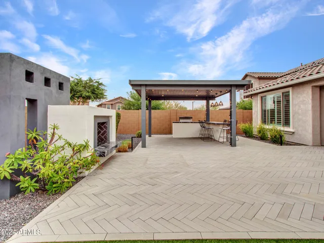 a patio with table and chairs