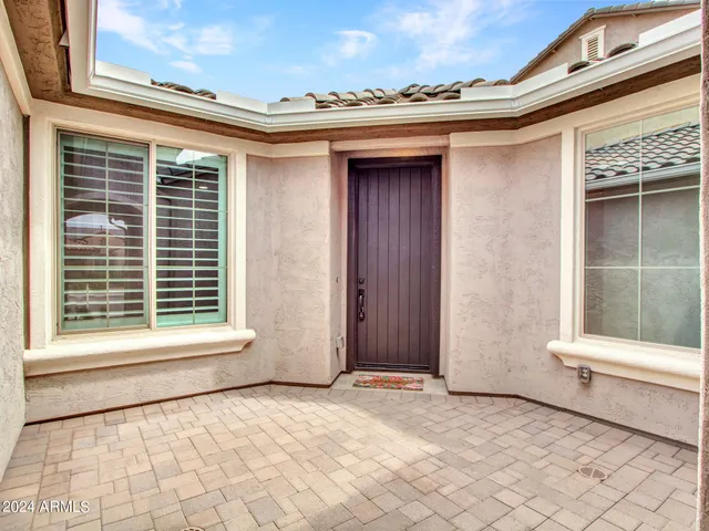 a view of a house with a door and chair