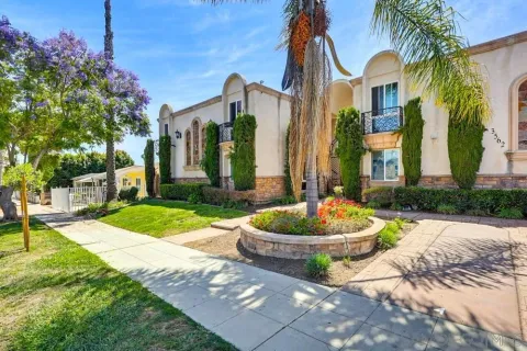a front view of a house with swimming pool and a yard
