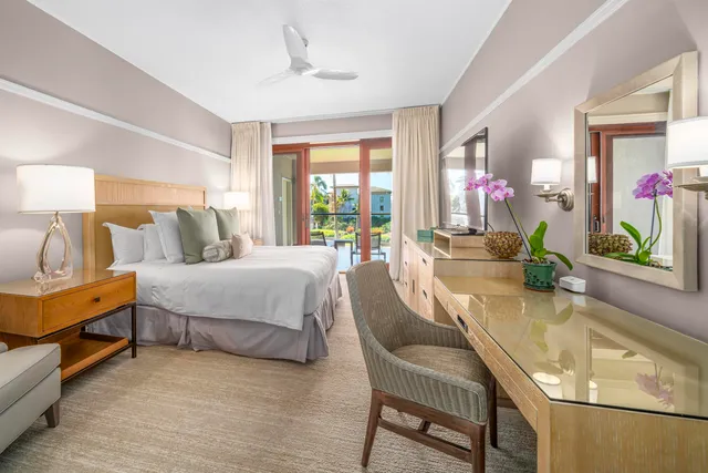 a view of a dining room with furniture and a chandelier