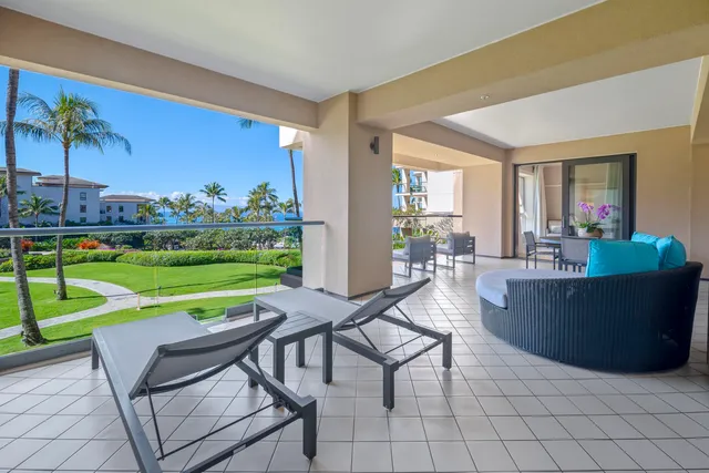 a living room with furniture and a garden
