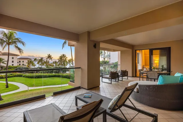 a living room with furniture a window and a table