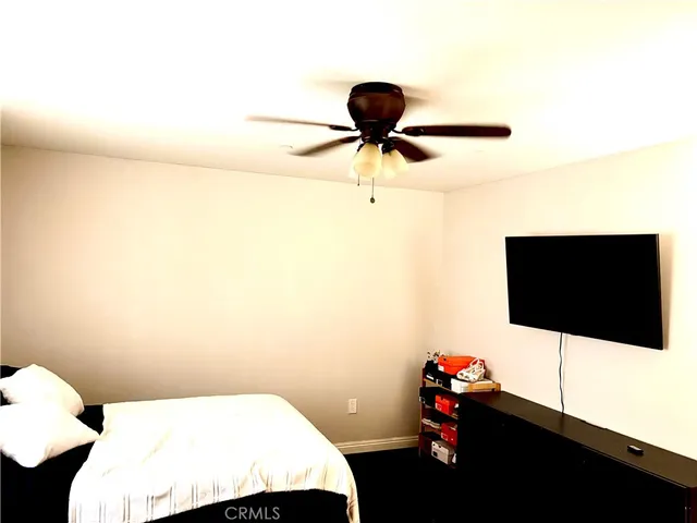 a living room with a couch and a flat screen tv